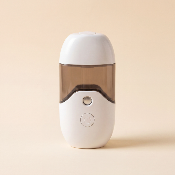 FloatMist Humidifier with mist appearing to hover mid-air on a cream desk